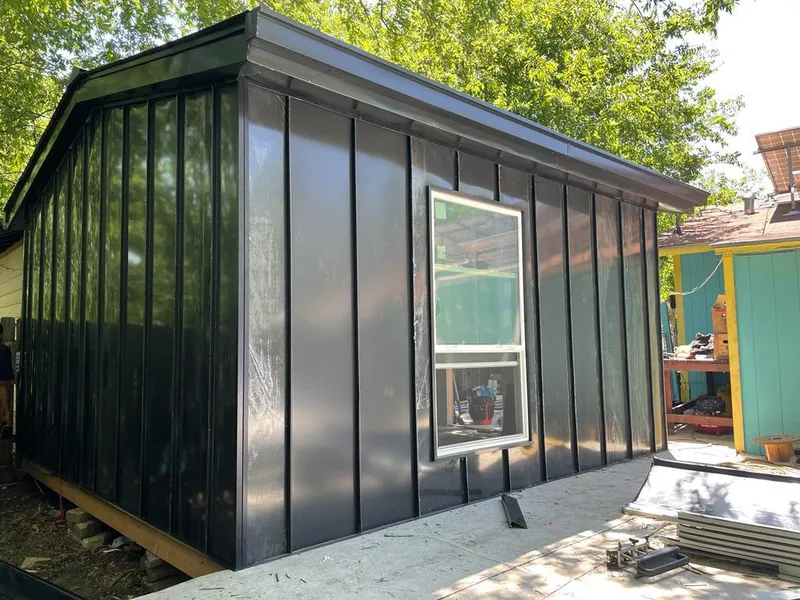 Black standing seam metal wall panels for Roof Inspection in Traverse City