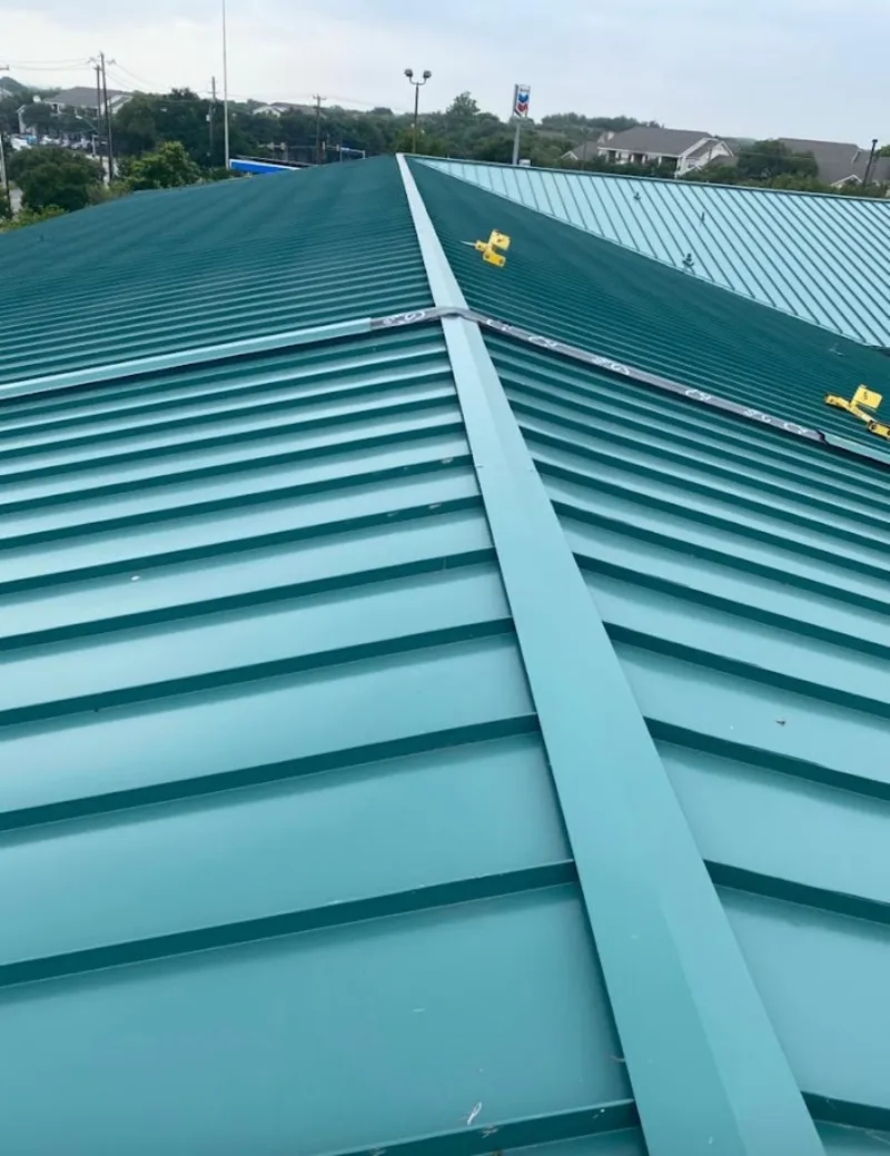 Green commercial metal roof ridge and valley for Metal Roof Repair in Traverse City