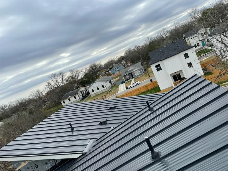 Standing seam metal roof panels with vents for Skylight Repair in Traverse City